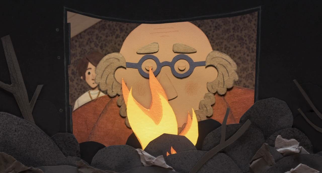 Pierrot schaut in einen Kohleofen, in dem ein Feuer brennt.