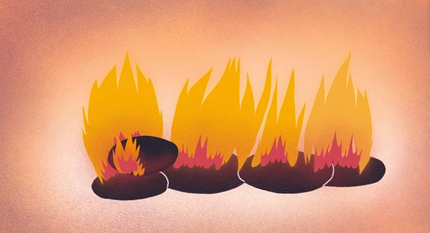 Kohle wird in den Ofen geworfen, damit das Feuer brennt.